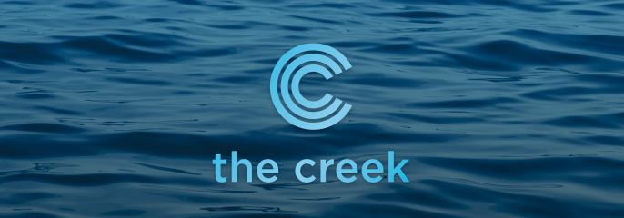 logo the creek by concert properties